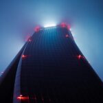 a very tall building with some lights on it